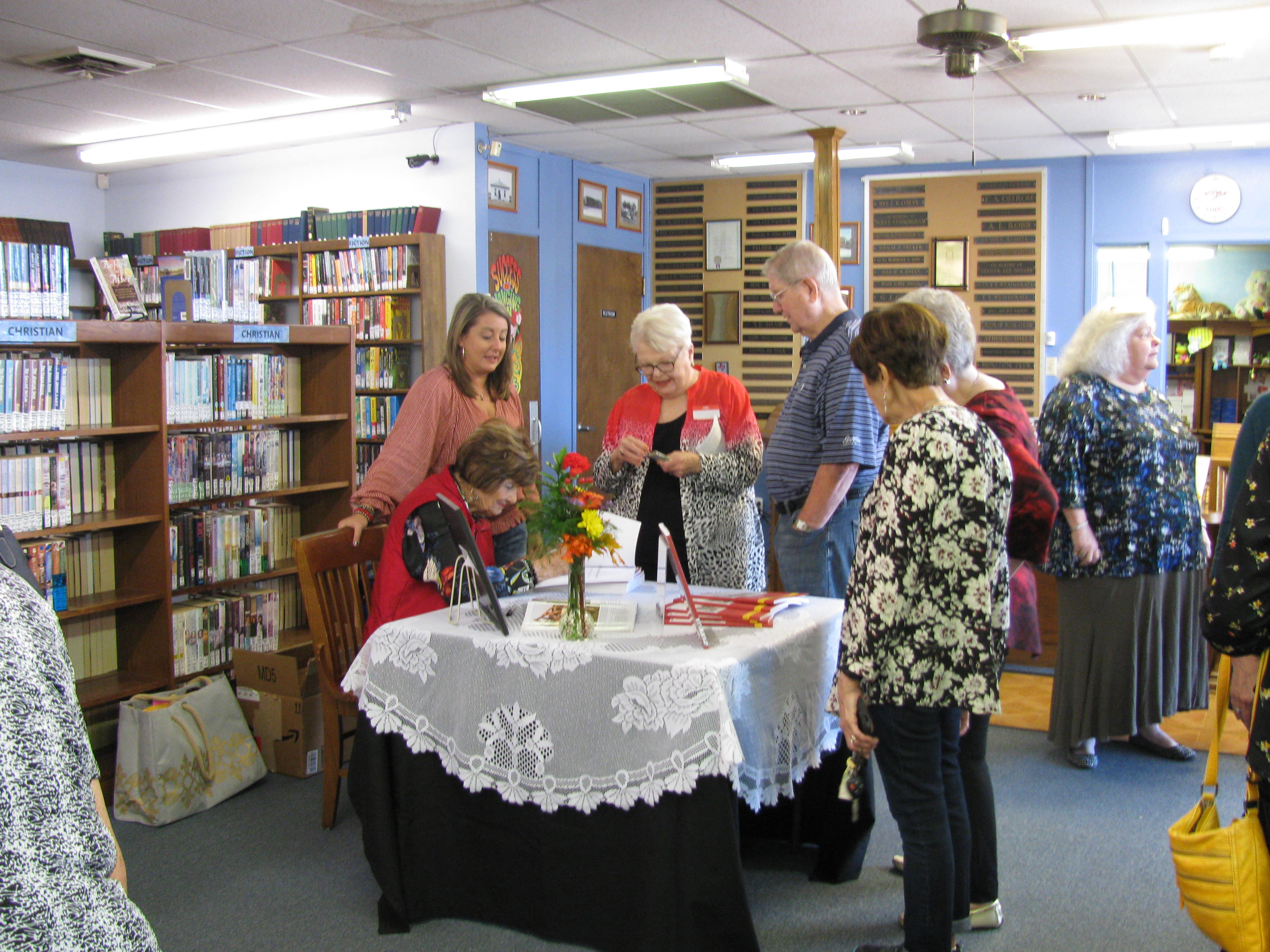 Ms. Beisch busy signing her books.JPG